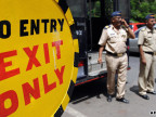 Indian policeman guard a street outside